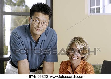 Portrait of businesswoman and a businessman in an office View Large Photo Image Stock Image - Portrait of businesswoman and a businessman in an office. Fotosearch