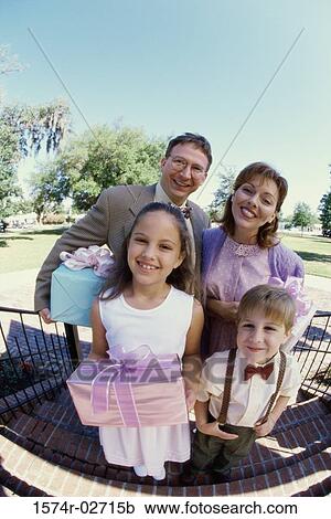 Stock Image - Portrait of parents with their son and daughter. Fotosearch