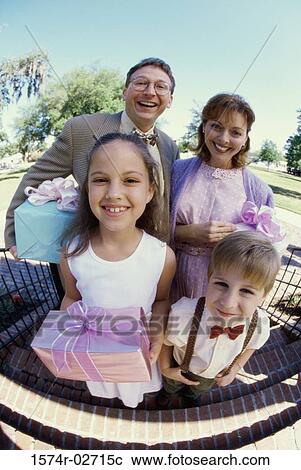 Stock Image - Portrait of parents with their son and daughter. Fotosearch