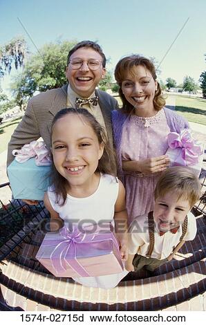 Stock Image - Portrait of parents with their son and daughter. Fotosearch