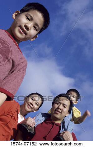 Stock Image - Portrait of parents with their two sons. Fotosearch