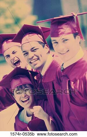Stock Image - Portrait of three male graduates and a female graduate. Fotosearch