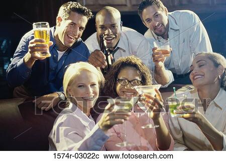 Stock Image - Portrait of three young couples toasting with glasses. Fotosearch