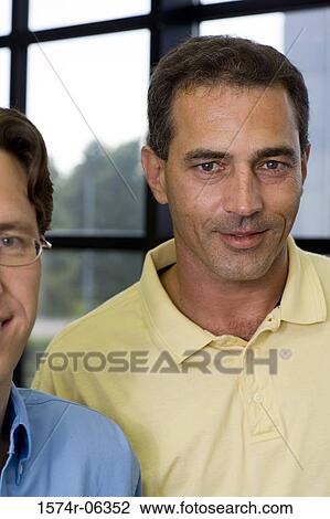 Portrait of two businessmen in an office View Large Photo Image Stock Image - Portrait of two businessmen in an office. Fotosearch