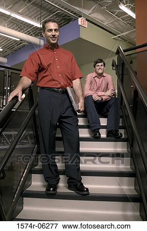 Portrait of two businessmen on a staircase View Large Photo Image Stock Photo - Portrait of two businessmen on a staircase. Fotosearch
