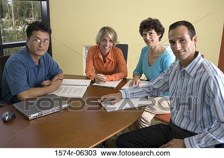 Portrait of two businesswomen and two businessmen in an office View Large Photo Image Stock Image - Portrait of two businesswomen and two businessmen in an office. Fotosearch