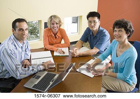 Portrait of two businesswomen and two businessmen in an office View Large Photo Image Stock Photo - Portrait of two businesswomen and two businessmen in an office. Fotosearch