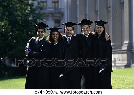 Stock Image - Portrait of two female graduates and three male graduates holding diplomas. Fotosearch