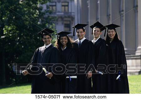 Stock Image - Portrait of two female graduates and three male graduates holding diplomas. Fotosearch