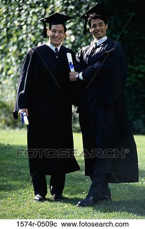 Portrait of two male graduates smiling View Large Photo Image Stock Image - Portrait of two male graduates smiling. Fotosearch
