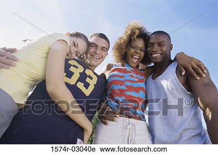 Portrait of two young couples smiling together View Large Photo Image Stock Image - Portrait of two young couples smiling together. Fotosearch