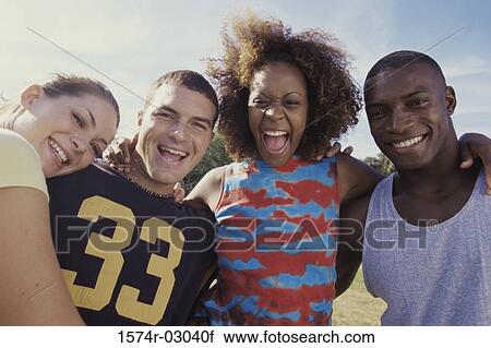 Portrait of two young couples smiling together View Large Photo Image Stock Image - Portrait of two young couples smiling together. Fotosearch