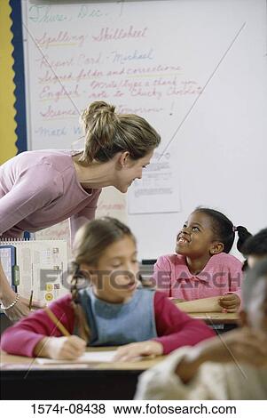 School children in a classroom with a female teacher View Large Photo Image Stock Photo - School children in a classroom with a female teacher. Fotosearch
