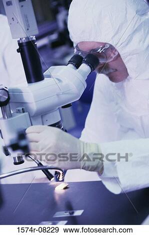 Scientist using a microscope View Large Photo Image Stock Photo - Scientist using a microscope. Fotosearch