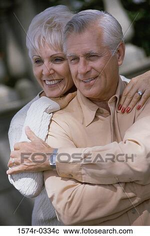 Stock Image - Senior couple embracing each other. Fotosearch