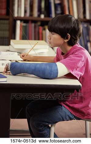 Side profile of a boy studying View Large Photo Image Stock Image - Side profile of a boy studying. Fotosearch
