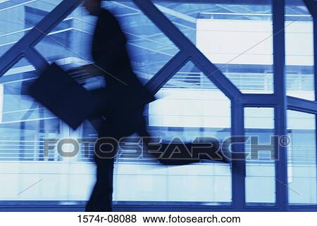 Stock Photo - Side profile of a businessman running. Fotosearch