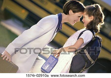 Side profile of a mother and her daughter looking at each other View Large Photo Image Stock Image - Side profile of a mother and her daughter looking at each other. Fotosearch