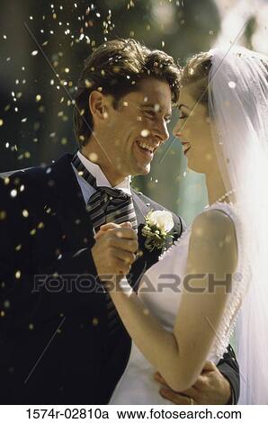Side profile of a newlywed couple dancing View Large Photo Image Stock Image - Side profile of a newlywed couple dancing. Fotosearch