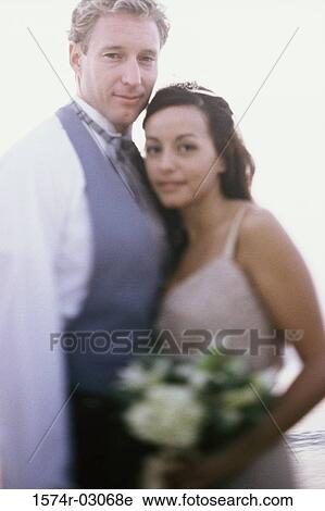 Side profile of a young couple smiling View Large Photo Image Stock Image - Side profile of a young couple smiling. Fotosearch
