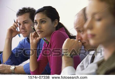Side profile of business executives in an office View Large Photo Image Stock Photo - Side profile of business executives in an office. Fotosearch