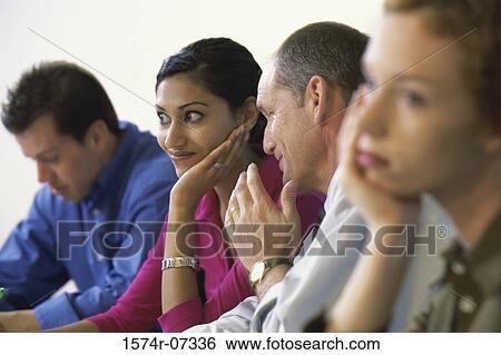 Side profile of business executives in an office View Large Photo Image Stock Photograph - Side profile of business executives in an office. Fotosearch