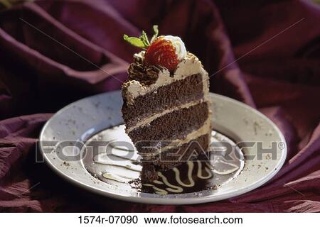 Slice of fruit cake on a plate View Large Photo Image Stock Image - Slice of fruit cake on a plate. Fotosearch