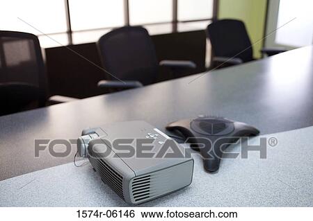 Slide projector and a conference phone on the table in a boardroom View Large Photo Image Stock Photograph - Slide projector and a conference phone on the table in a boardroom. Fotosearch
