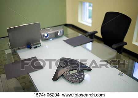 Picture - Slide projector and conference phone in a conference room. Fotosearch