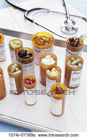 Stock Image - Stethoscope and vials of pills. Fotosearch