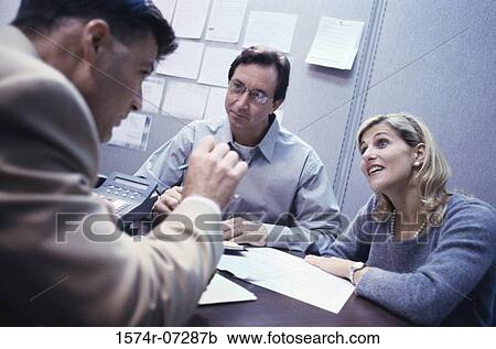 Three business executives in a meeting View Large Photo Image Stock Image - Three business executives in a meeting. Fotosearch