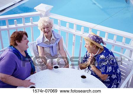 Three senior women sitting together talking View Large Photo Image Stock Photo - Three senior women sitting together talking. Fotosearch
