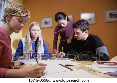Three teenage girls and a teenage boy studying together View Large Photo Image Stock Image - Three teenage girls and a teenage boy studying together. Fotosearch