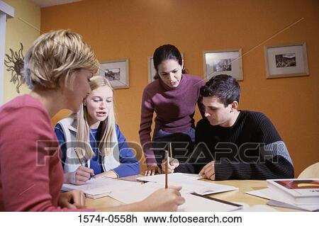 Three teenage girls and a teenage boy studying together View Large Photo Image Stock Image - Three teenage girls and a teenage boy studying together. Fotosearch