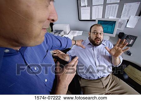 Two businessmen discussing in an office View Large Photo Image Stock Image - Two businessmen discussing in an office. Fotosearch
