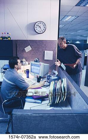 Stock Image - Two businessmen in an office. Fotosearch