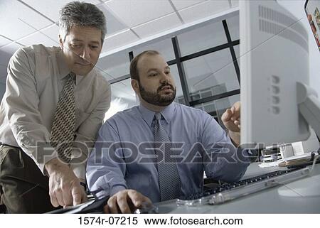 Two businessmen in an office View Large Photo Image Stock Photography - Two businessmen in an office. Fotosearch