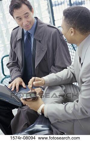 Two businessmen talking View Large Photo Image Picture - Two businessmen talking. Fotosearch