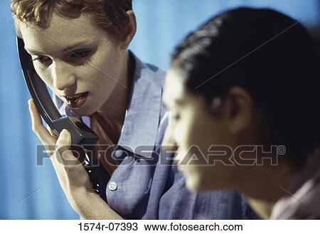 Stock Image - Two businesswomen in an office. Fotosearch