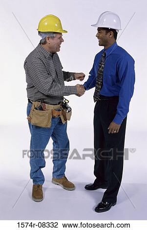 Two foremen shaking hands View Large Photo Image Stock Image - Two foremen shaking hands. Fotosearch