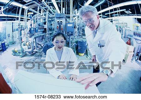 Two researchers working on a computer View Large Photo Image Stock Image - Two researchers working on a computer. Fotosearch