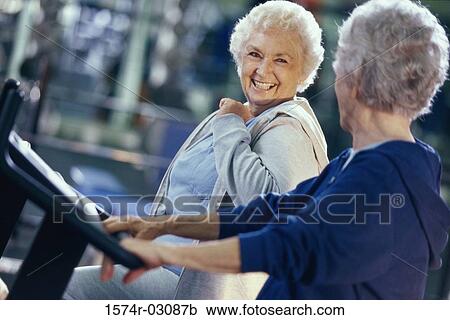 Two senior women exercising in a health club View Large Photo Image Stock Image - Two senior women exercising in a health club. Fotosearch