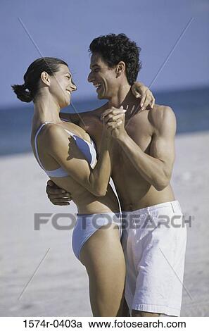 Young couple dancing on the beach View Large Photo Image Stock Image - Young couple dancing on the beach. Fotosearch