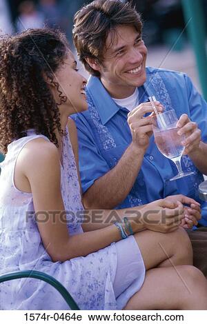 Young couple smiling together View Large Photo Image Stock Image - Young couple smiling together. Fotosearch