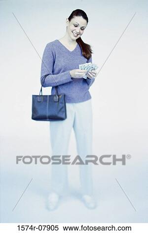 Young woman counting money View Large Photo Image Stock Photography - Young woman counting money. Fotosearch
