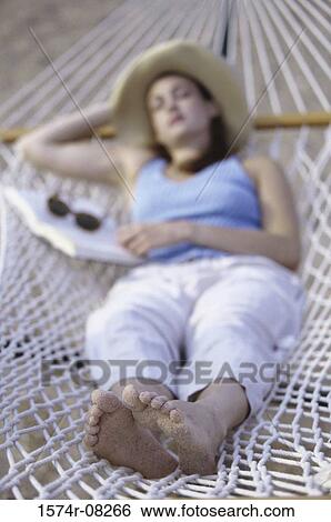 Young woman sleeping in a hammock View Large Photo Image Stock Photograph - Young woman sleeping in a hammock. Fotosearch