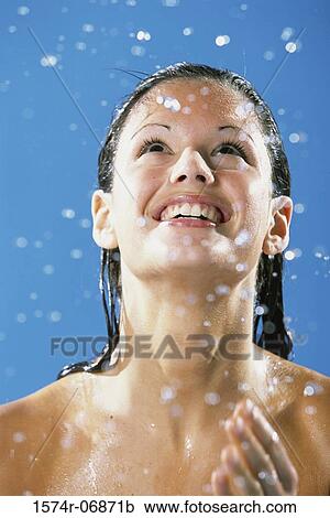 Young woman taking a shower looking up View Large Photo Image Stock Image - Young woman taking a shower looking up. Fotosearch