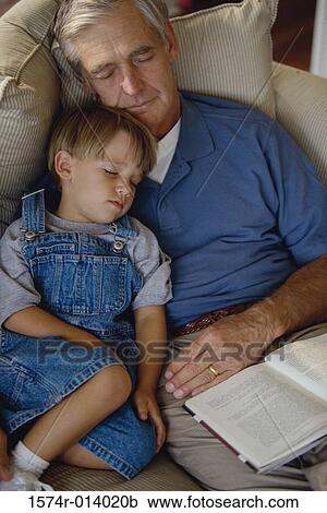 Boy sleeping with his grandfather View Large Photo Image Stock Image - Boy sleeping with his grandfather. Fotosearch