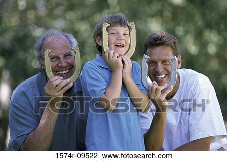 Boy with his father and grandfather holding horseshoes View Large Photo Image Stock Image - Boy with his father and grandfather holding horseshoes. Fotosearch