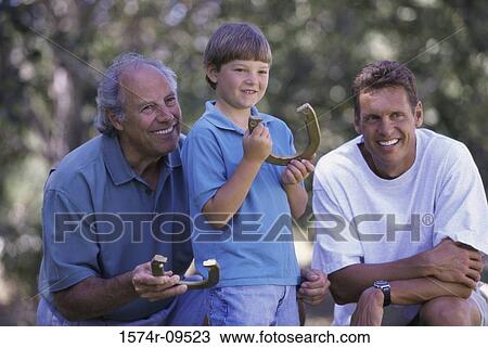 Boy with his father and grandfather holding horseshoes View Large Photo Image Stock Image - Boy with his father and grandfather holding horseshoes. Fotosearch